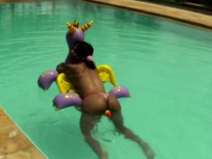 Cheerful teen shemale shows off sexy ass in thongs poolside