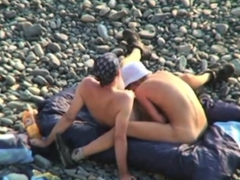 Voyeur on public beach. Oral sex